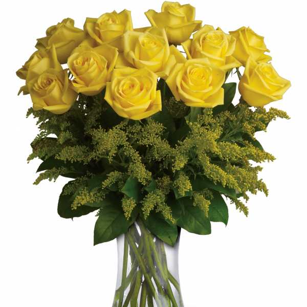 Yellow roses arranged in a clear glass vase