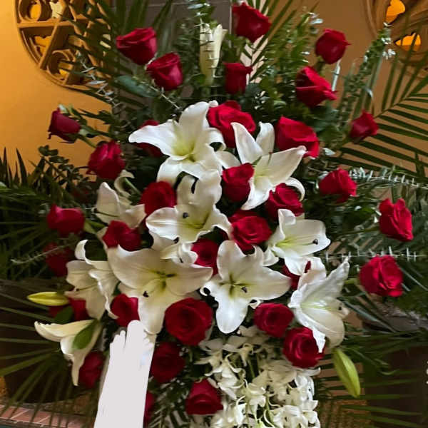 Large arrangement of red roses and white lilies