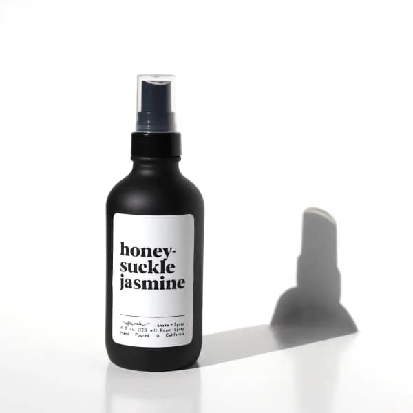 Black honeysuckle jasmine room spray bottle with white label on white background