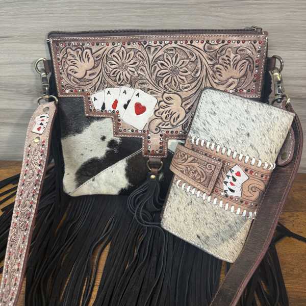 Decorative leather handbag with fringe and playing-card accents