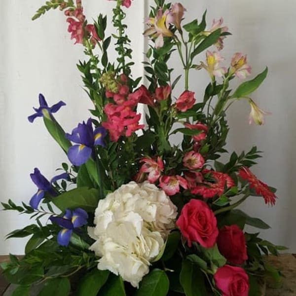 Mixed floral arrangement with pink, white, and purple blooms