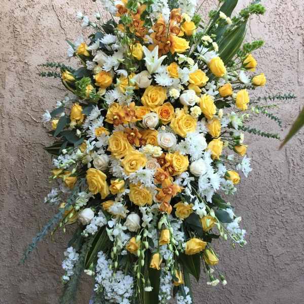 Large standing floral spray with yellow and white flowers