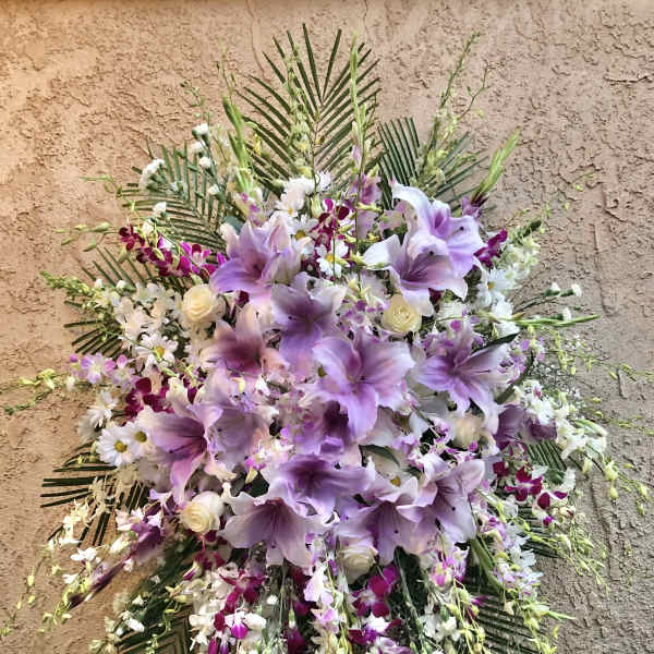 Large floral spray with lavender lilies and white orchids