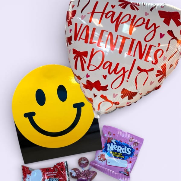 Valentine's Day balloon with assorted candy and a smiley face card
