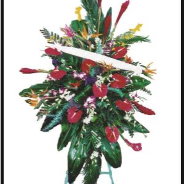Tall tropical floral standing spray with red blooms on a stand