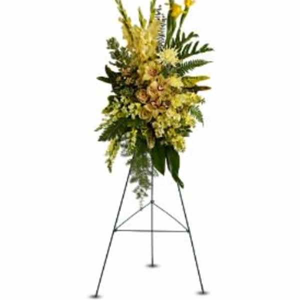 Tall yellow floral standing spray on an easel