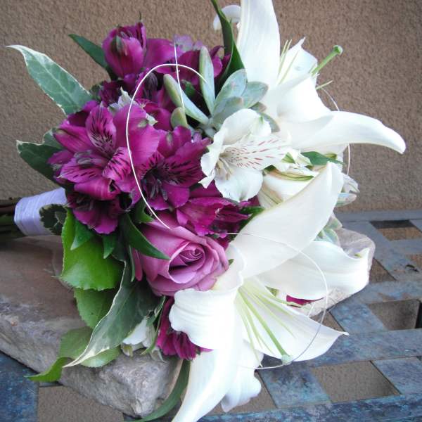 Bouquet of white lilies, purple alstroemeria, and a pink rose