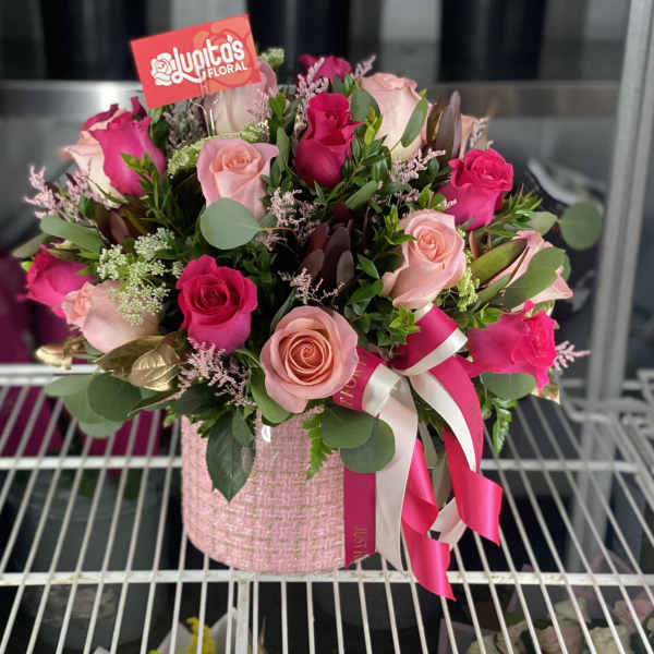 Pink and magenta rose bouquet in a pink textured box with ribbon