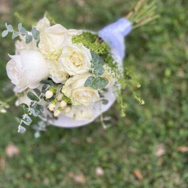 White rose bouquet with eucalyptus and small berries