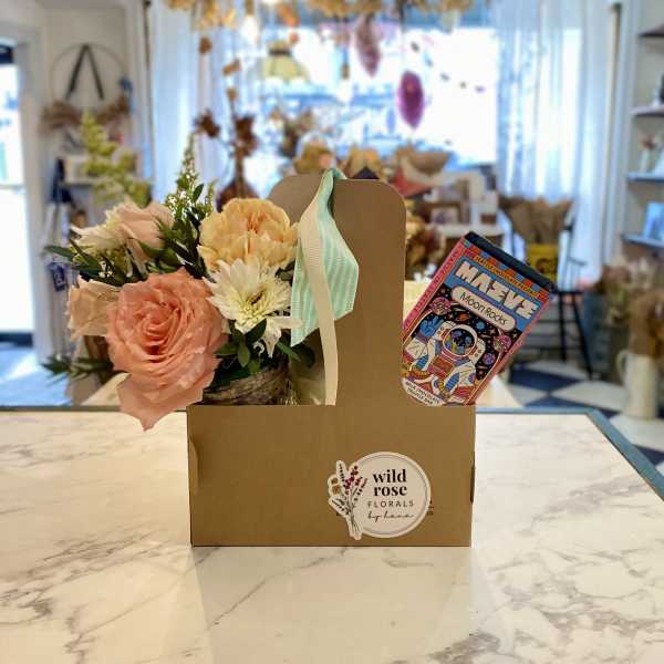 Small floral gift box with pastel flowers and a chocolate bar