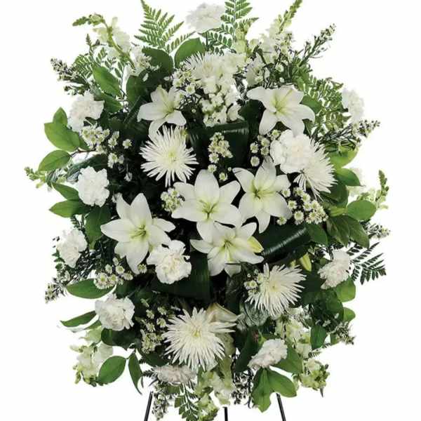 A classic white floral sympathy standing spray