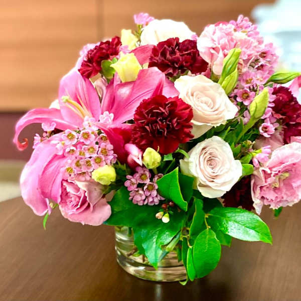 Pink and white mixed bouquet in a clear glass vase