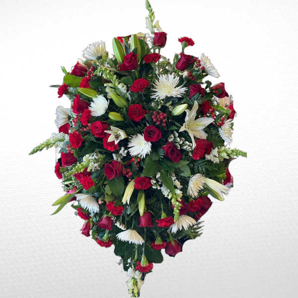 Heart-shaped floral spray with red roses and white lilies