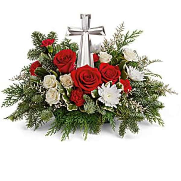 Red and white rose arrangement with a silver cross centerpiece
