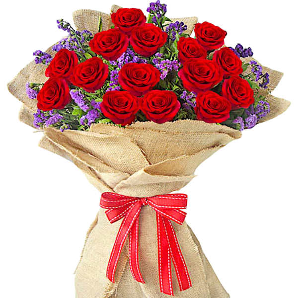 Bouquet of red roses with purple filler wrapped in burlap and tied with a red ribbon