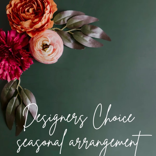 Floral arrangement with orange, pink, and magenta blooms on a dark green background