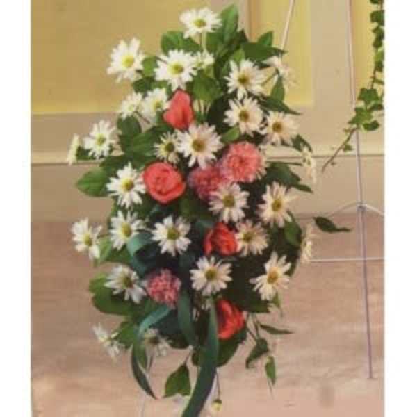Tall floral arrangement with white daisies and coral roses