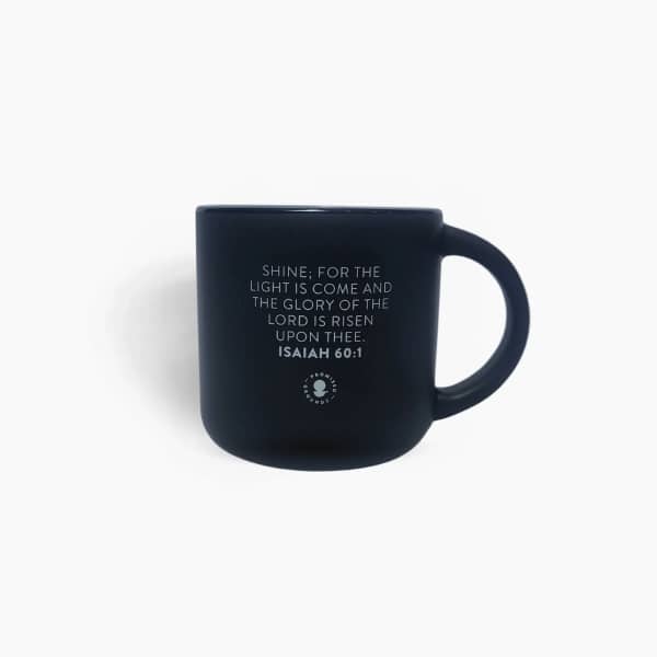 Black mug with a Bible verse printed on the front