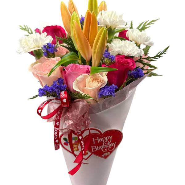Bouquet of lilies, roses, and carnations with a birthday heart tag