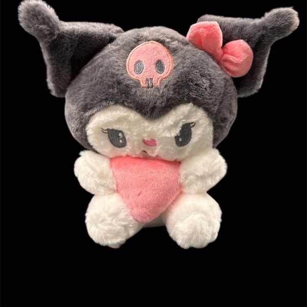 Plush character toy with a pink heart and bow on a black background