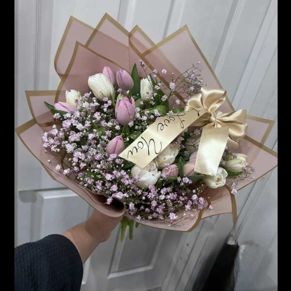 Pink and white tulip bouquet with baby's breath and a satin ribbon
