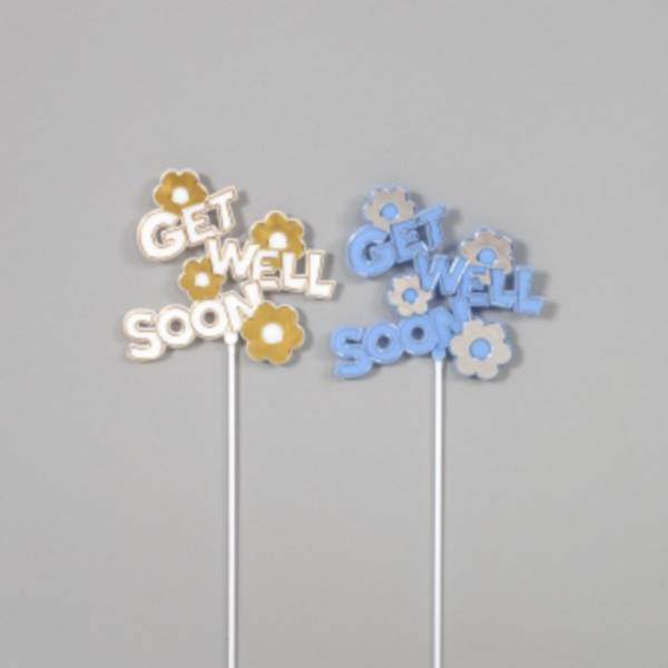 Two flower-shaped cake toppers reading "GET WELL SOON" in yellow and blue.