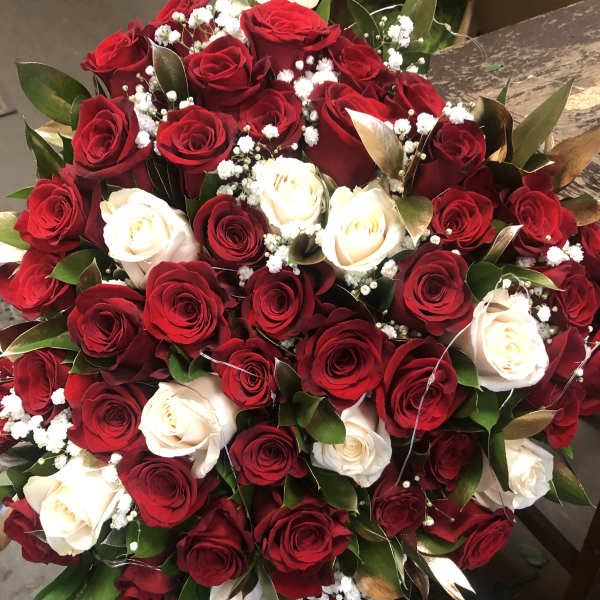 Bouquet of red and white roses with baby's breath