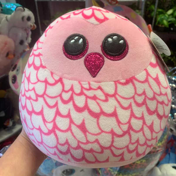 Pink and white owl plush toy with glittery eyes