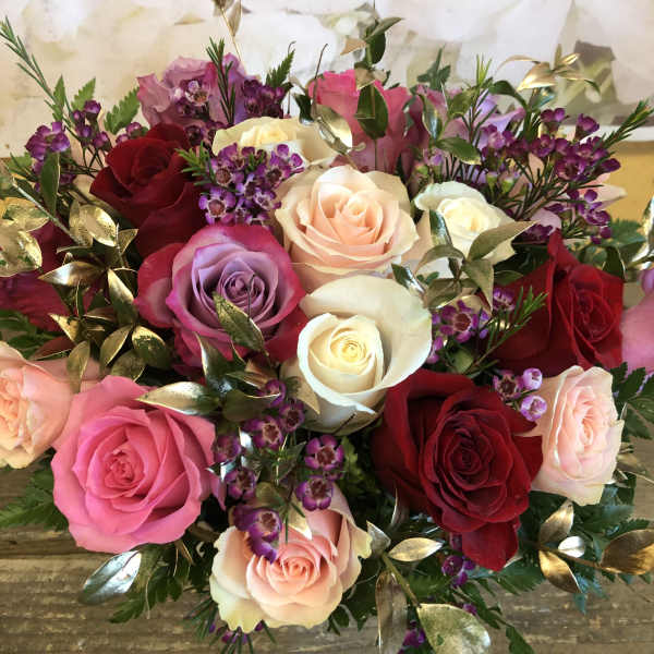 Mixed bouquet of roses in pink, red, white, and lavender