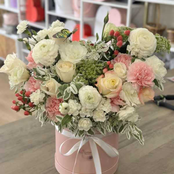 Pink hatbox arrangement with white and blush roses and carnations