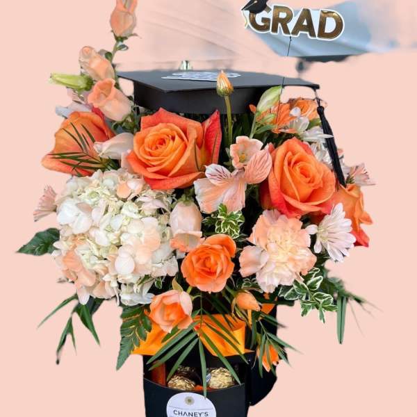 Graduation bouquet with orange roses and a cap topper