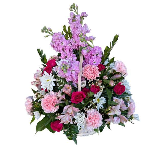 Basket arrangement of pink and purple flowers with white daisies and roses