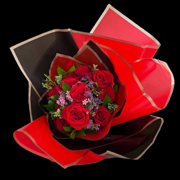 Bouquet of red roses wrapped in red and black paper