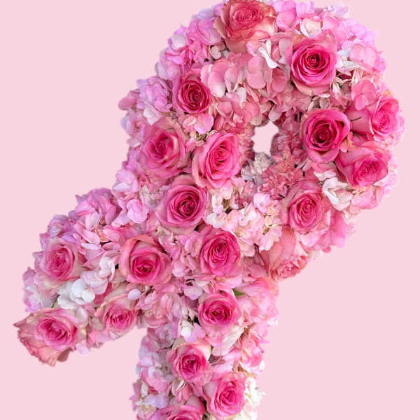 Pink rose and hydrangea floral arrangement shaped like a number 4