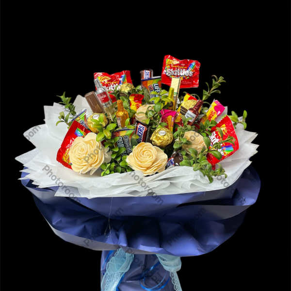 Candy bouquet with faux cream roses and assorted wrapped sweets