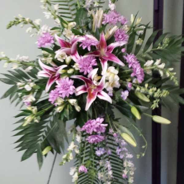 Standing floral spray with pink lilies and lavender flowers