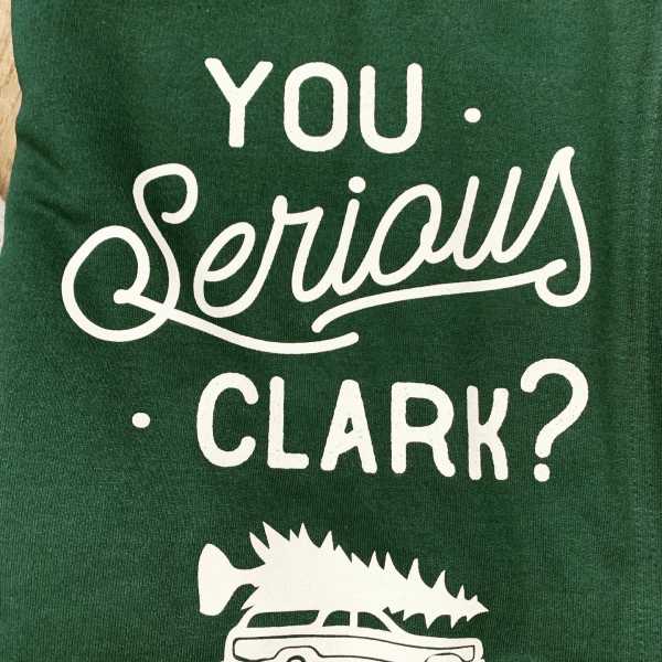 Green shirt with white text reading "You Serious Clark?"