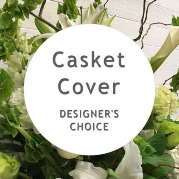 White casket cover with green and white flowers