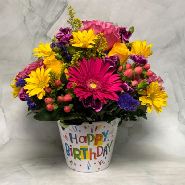 Bright mixed flower bouquet in a birthday pot
