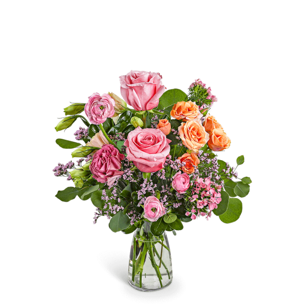 Pink and orange rose bouquet in a clear glass vase