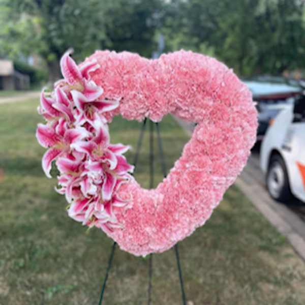 All carnations with lilies standing open heart