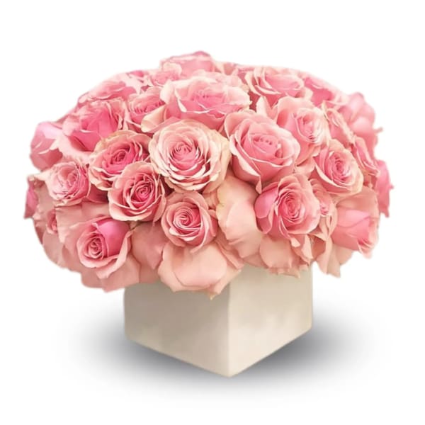 Bouquet of pink roses in a square box