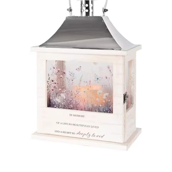 White memorial lantern with floral artwork and a metal handle