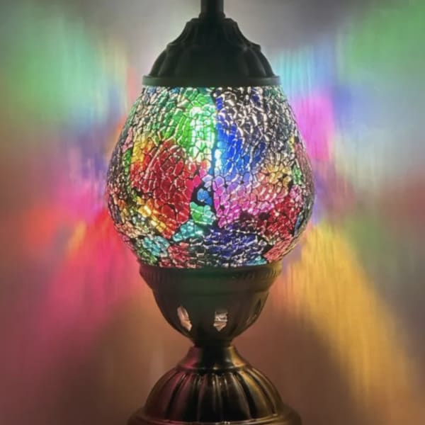 Colorful mosaic table lamp with a dark metal base