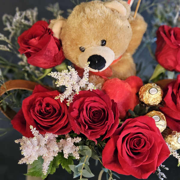 Red roses with a teddy bear and Ferrero Rocher chocolates