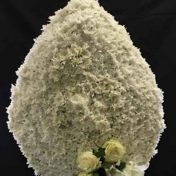 Large white floral spray with small cream roses and lilies