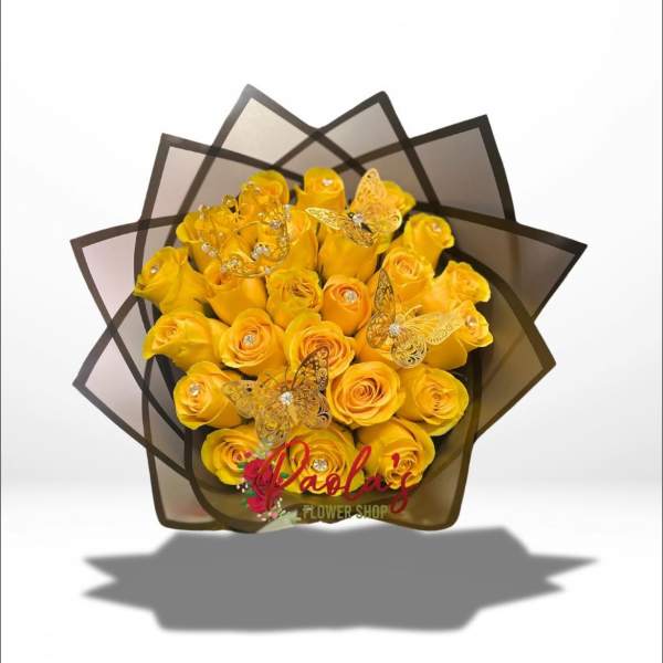 Bouquet of yellow roses wrapped in dark paper with butterfly picks