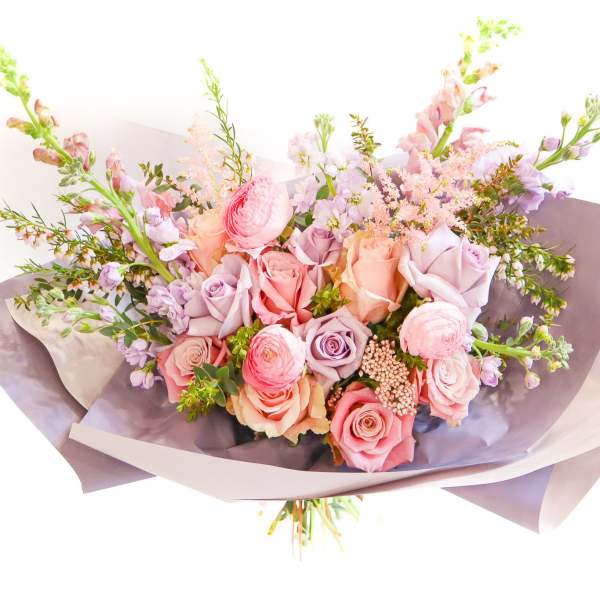 Bouquet of pink and lavender roses with airy filler flowers