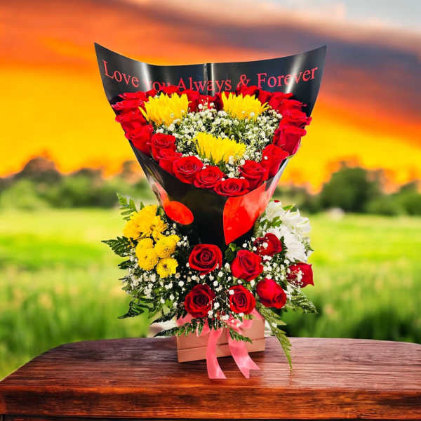Heart-shaped bouquet of red roses and yellow flowers in black wrap