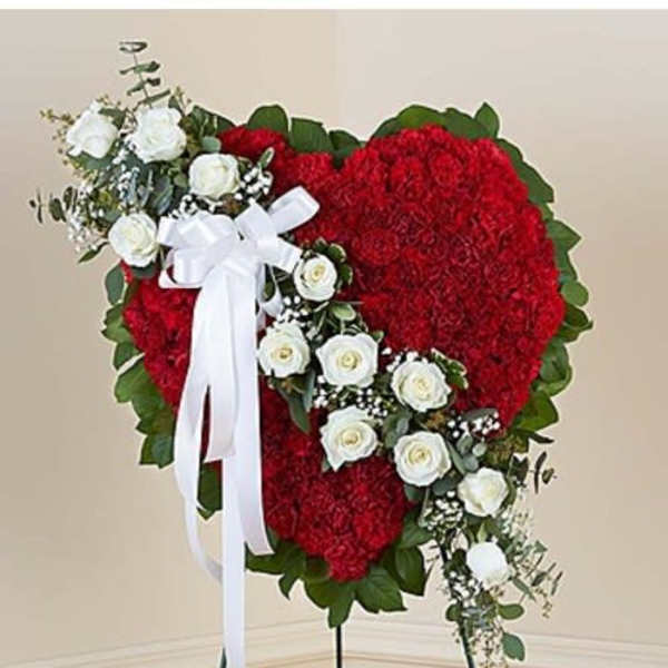 Heart-shaped red floral standing spray with white roses and ribbon